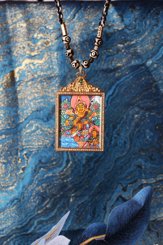 The Tibetan Buddhist Dual Yellow Jambhala Thangka pendant displayed as a sacred amulet for wealth and prosperity, embodying the doubled blessing of abundance in Tibetan Buddhist tradition.
