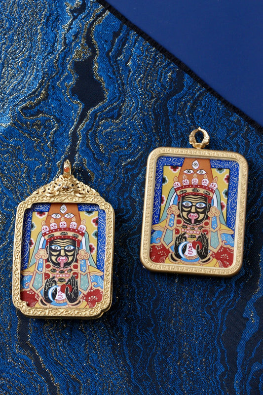 Tibetan Buddhist thangka pendant depicting Zaki Lhamo, the wealth protector deity, symbolizing prosperity, protection, and abundance.