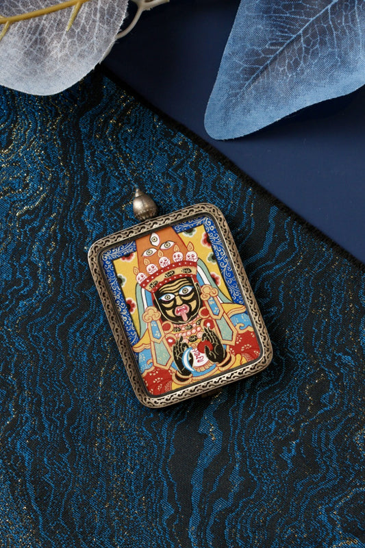 Tibetan thangka amulet featuring Dzaki Lhamo, the Tibetan prosperity goddess associated with fortune, generosity, and spiritual blessings.