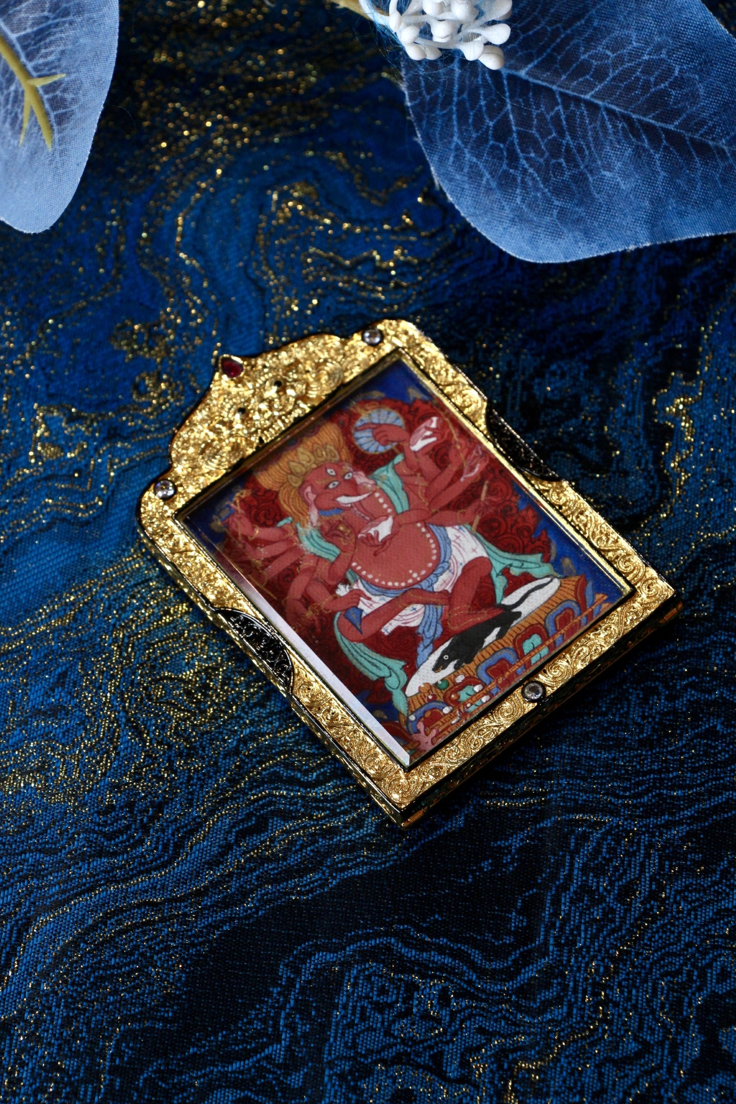 Tibetan Thangka of Elephant Nose God of Wealth (Tsondu), 4x5cm, with natural mineral paint and copper outer shell, representing Tibetan Buddhist culture.