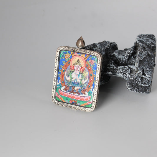 Hand-painted Rebgong Four-Armed Avalokiteshvara Thangka pendant featuring the Embodiment of Great Compassion, Dunhuang silver case, representing compassion and peace in Tibetan Buddhist tradition.
