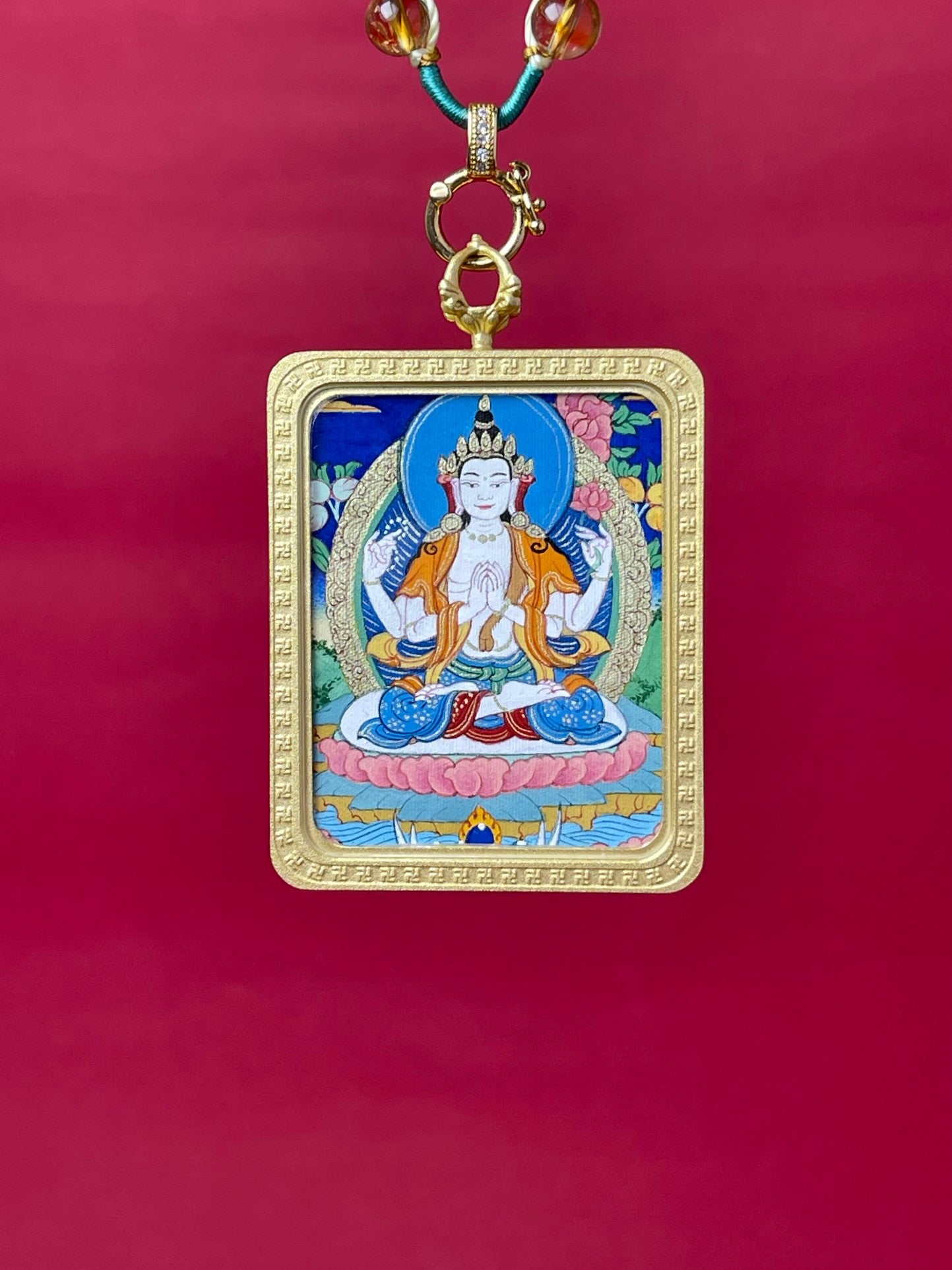  Detailed view of the refined hand-woven cord for the Four-Armed Avalokiteshvara Thangka pendant, symbolising compassion and tradition in Buddhist practice.
