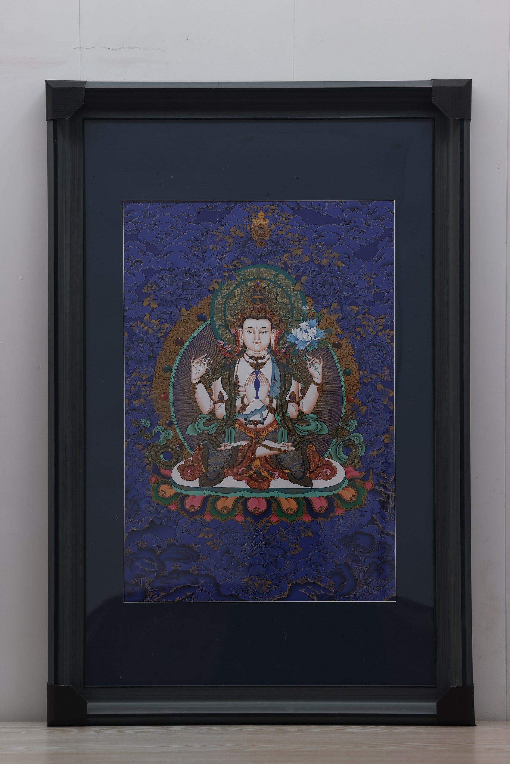 Four-Armed Guan Yin Bodhisattva Thangka, detailed Tibetan painting symbolizing mercy and enlightenment.