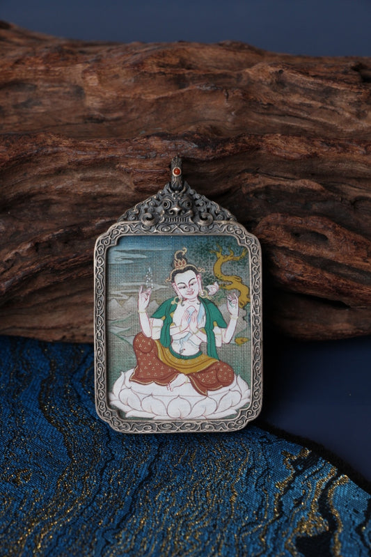 Thangka necklace portraying Four-Armed Avalokiteshvara, the bodhisattva of compassion guiding beings on the Tibetan Buddhist path.