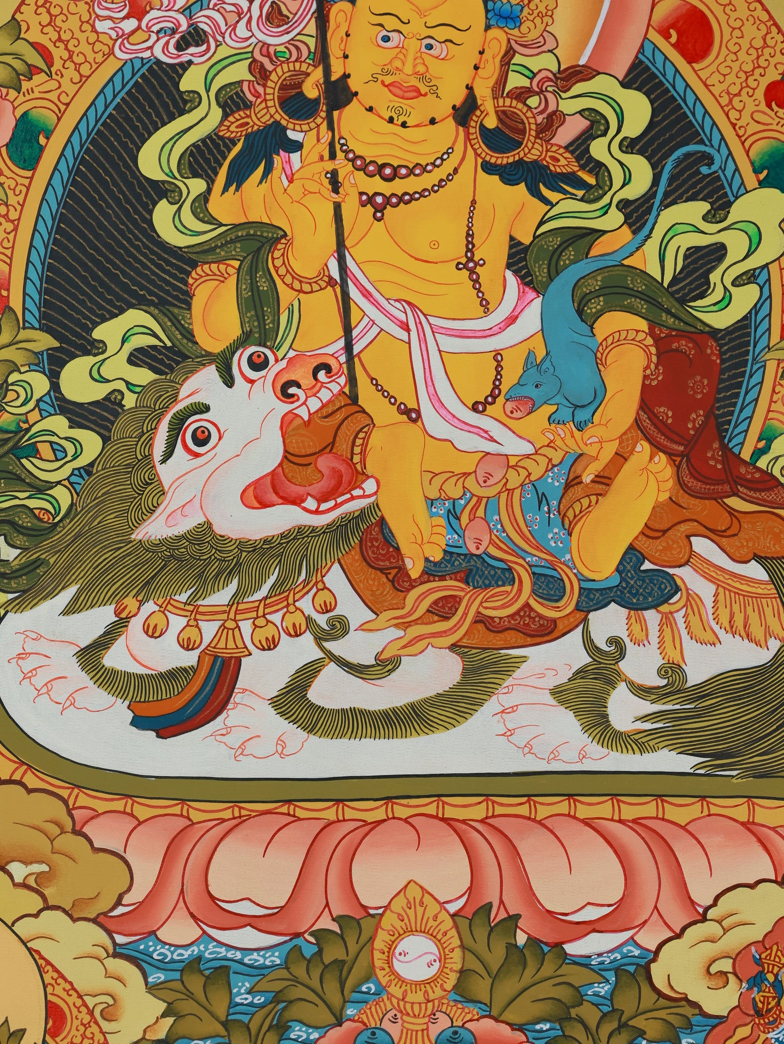 Buddhist wealth deity Jambhala illustrated in a colorful Tibetan thangka painting
