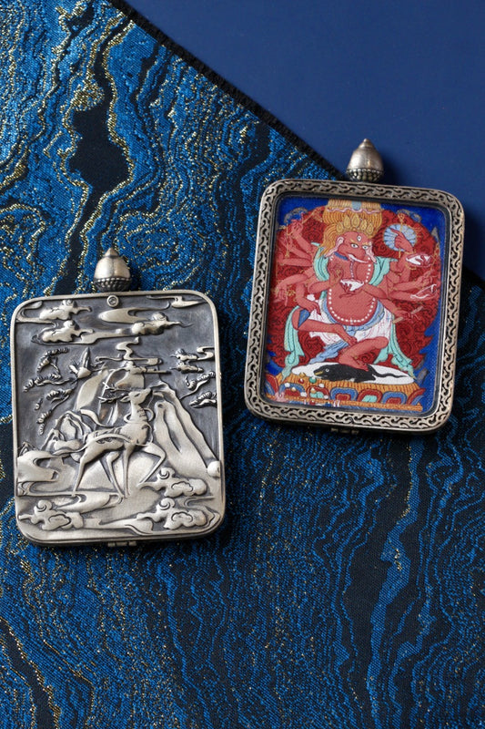 Ganapati thangka pendant depicting the Tibetan Buddhist elephant-headed deity of wealth, abundance, and prosperity.