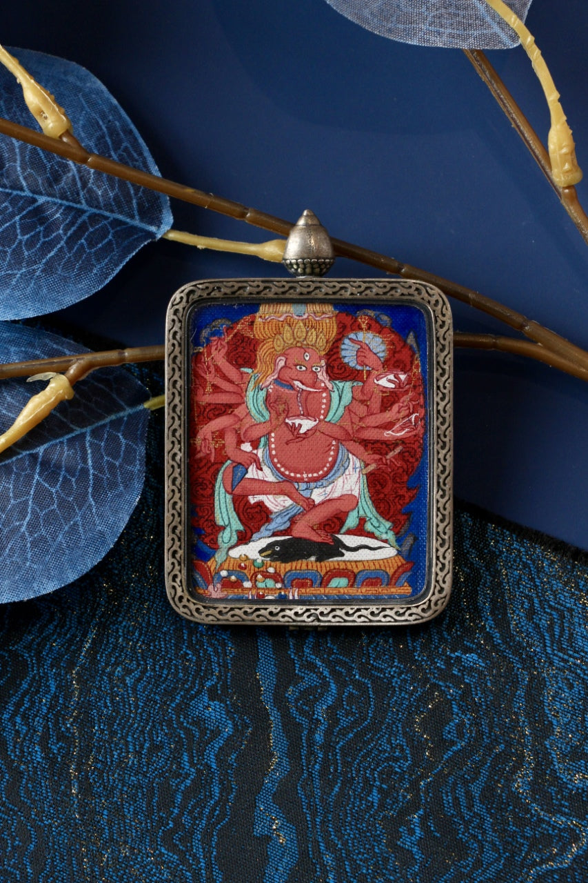 Ganapati wealth deity thangka amulet used in Tibetan Buddhism to attract abundance, prosperity, and spiritual protection.