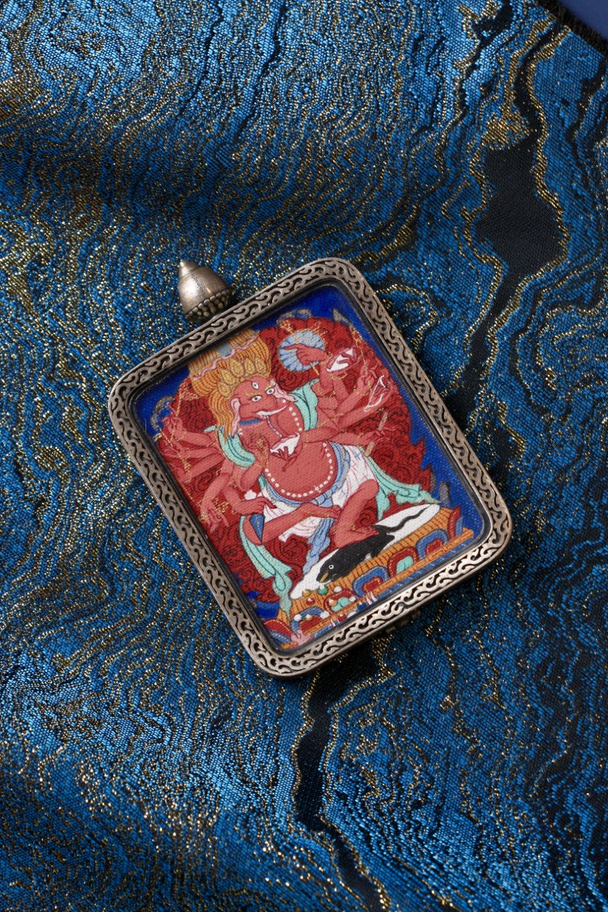 Tibetan thangka jewelry featuring Ganapati, inspired by traditional Tibetan Buddhist sacred art and iconography.