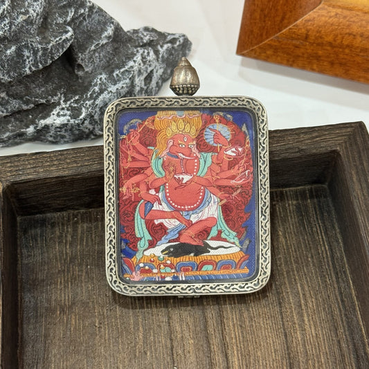  Hand-painted Tibet Qigang Ganesh (Vinayaka) Thangka pendant featuring the elephant-headed lord of success and obstacles, encased in silver, representing wealth and harmony in Tibetan Buddhist tradition.
