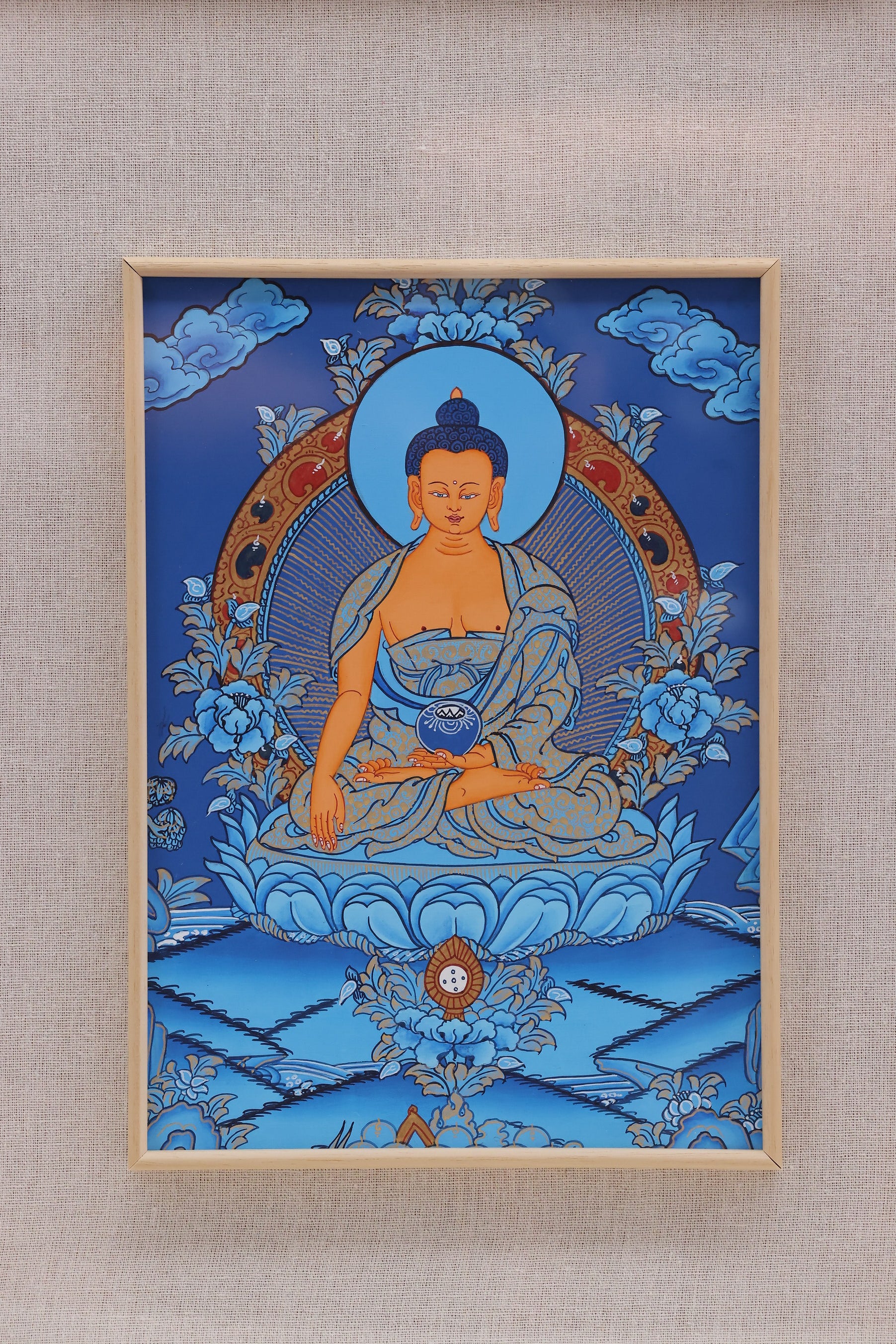 Hand-painted Tibetan blue thangka of Shakyamuni Buddha with mineral pigments and gold details