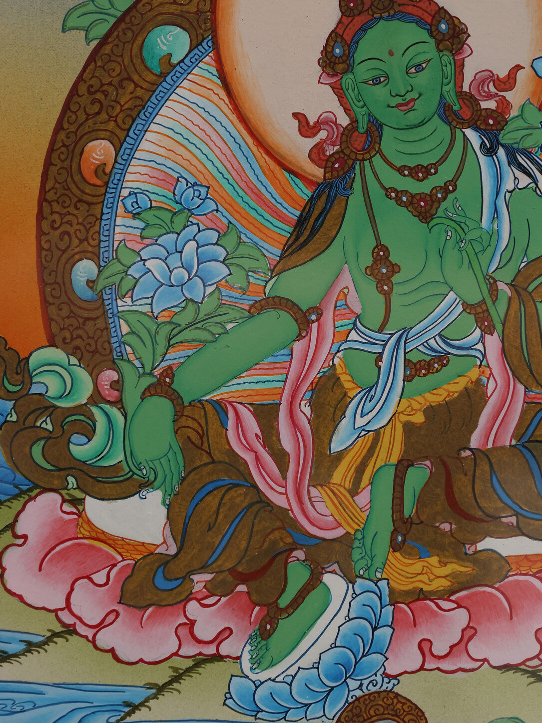 Alt text: Beautiful Green Tara Thangka artwork, highlighting Tibetan Buddhist spiritual symbolism.