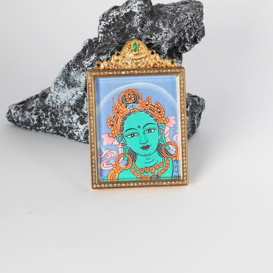  Close-up detail of the Nepal Bold Green Tara Buddha Head Thangka painting showing intricate natural mineral pigment work, showcasing the masterful artistry of Nepali lineage painters.
