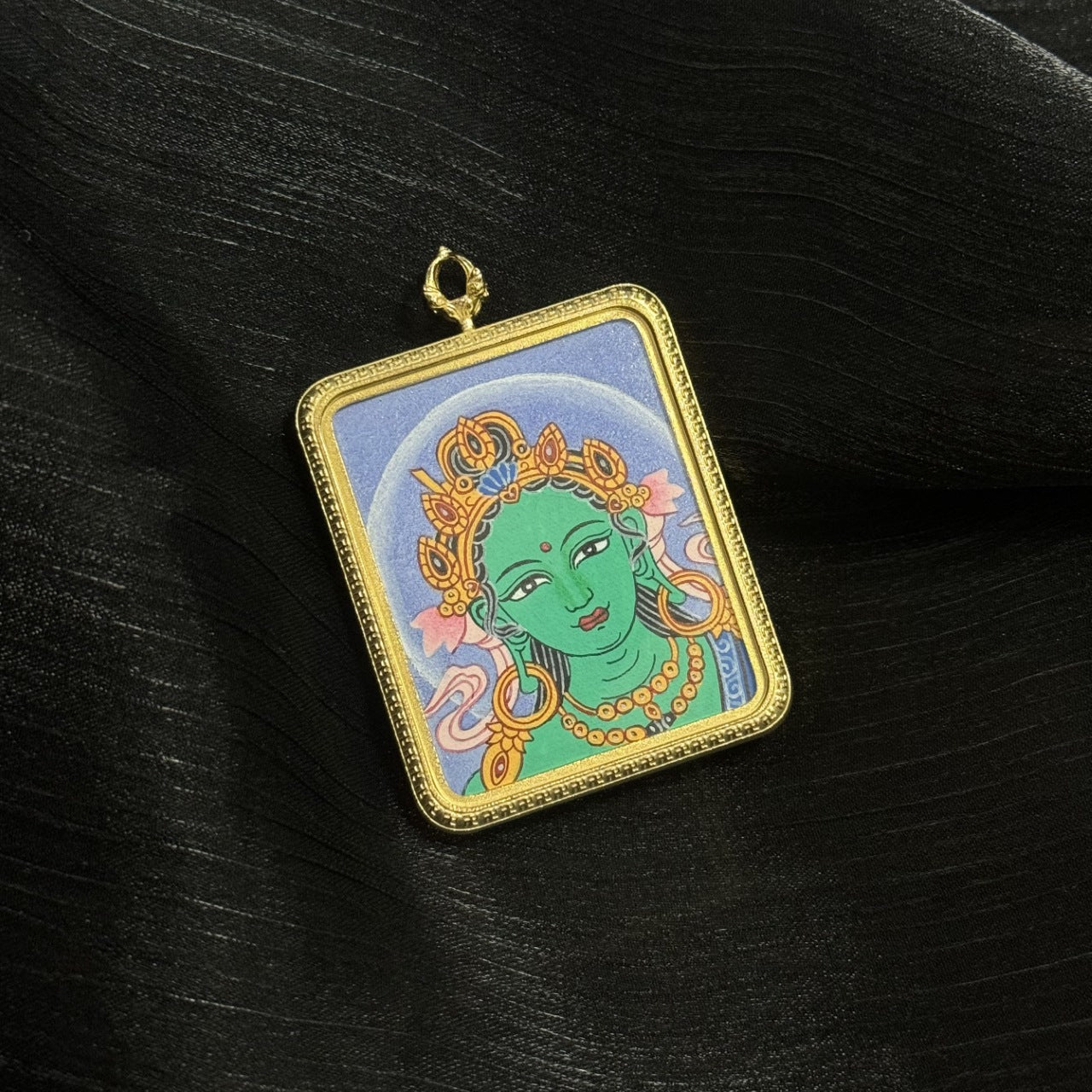  Close-up detail of the Nepal Bold Green Tara Buddha Head Thangka painting showing intricate natural mineral pigment work, showcasing the masterful artistry of Nepal Bold lineage painters.
