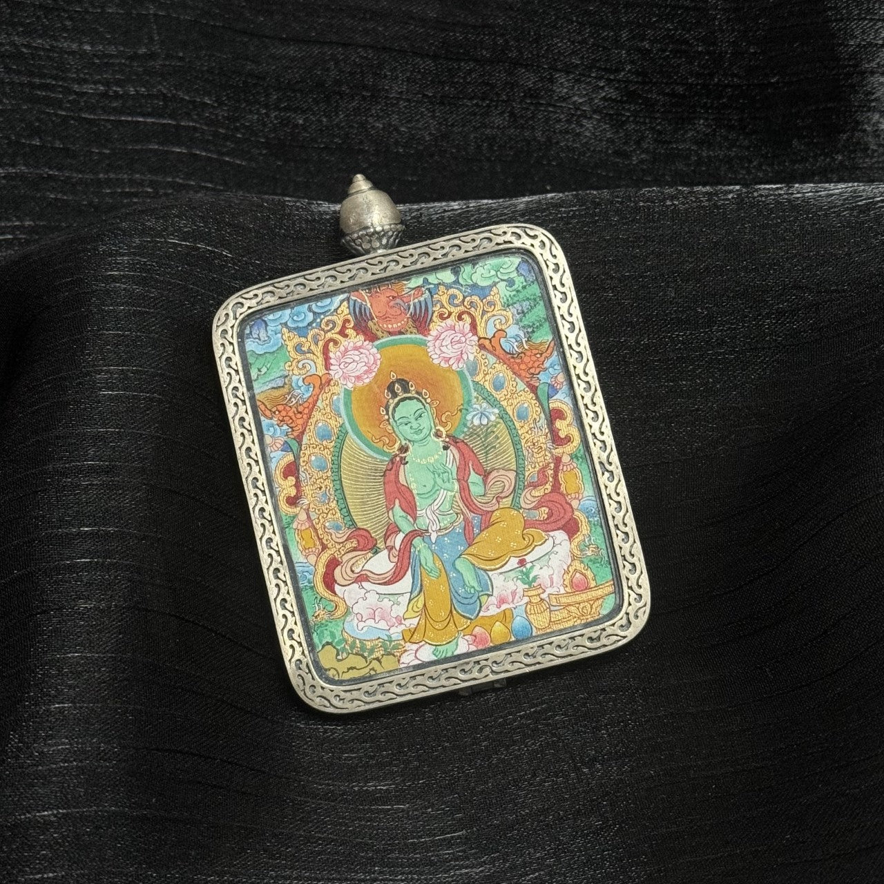 Detailed view of the 925 silver Dunhuang Nine-Colour Deer casing for the Green Tara Thangka pendant, symbolising protection and auspicious blessing in Tibetan Buddhist tradition.
