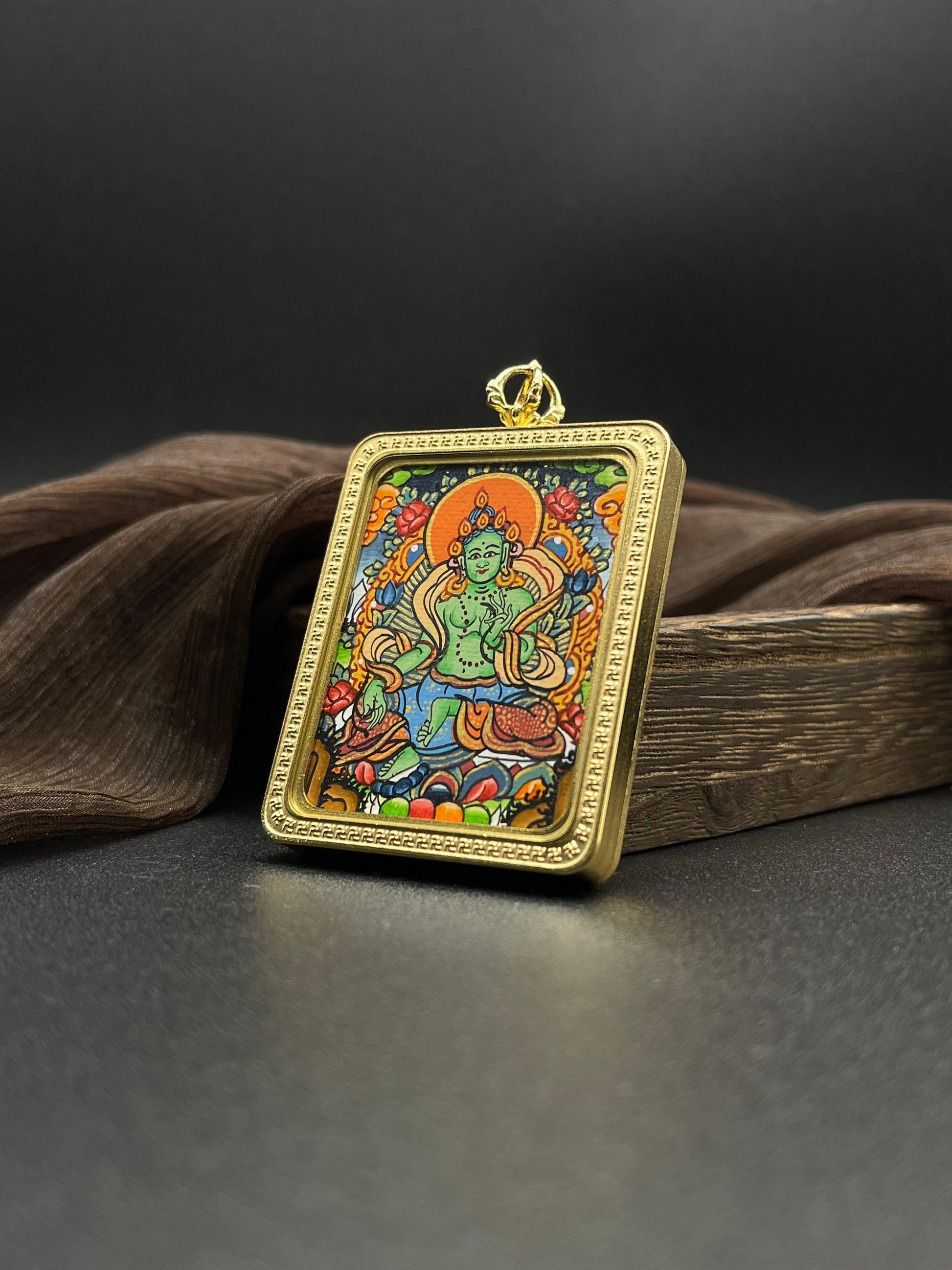  Close-up detail of the Nepal Green Tara Thangka showing hand-painted mineral pigments, showcasing the masterful artistry.

