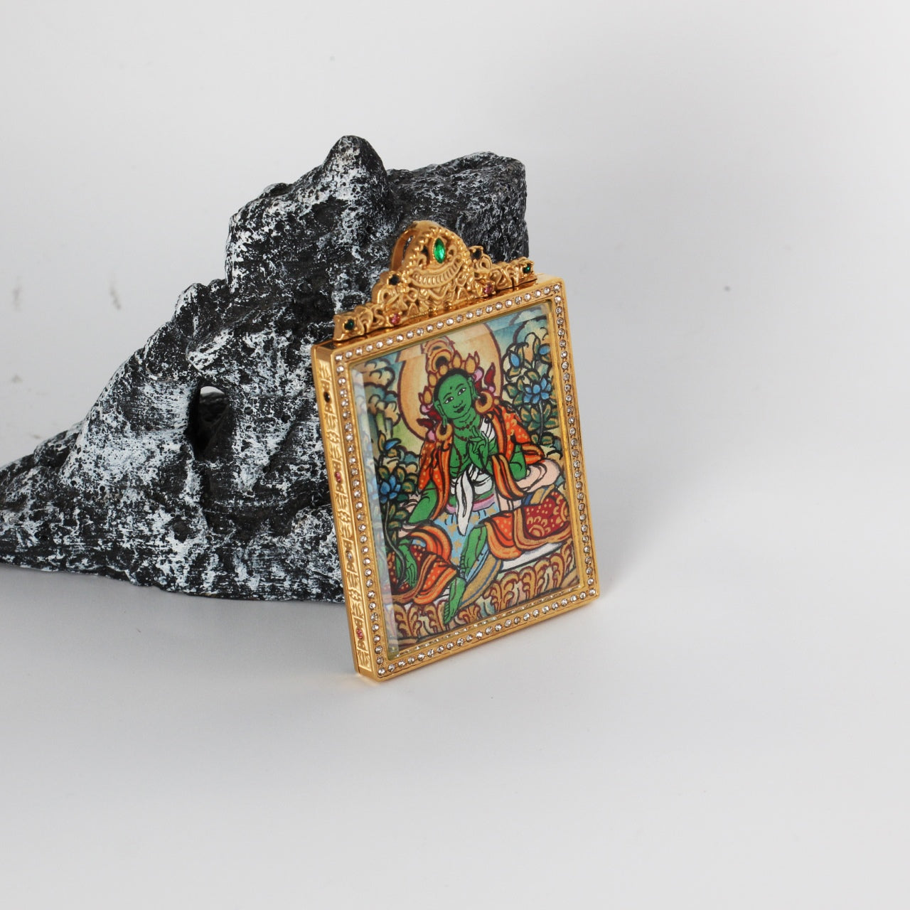  The Nepal Elegant Green Tara Thangka pendant displayed as a sacred amulet for compassion and swift success, embodying Tibetan Buddhist tradition.