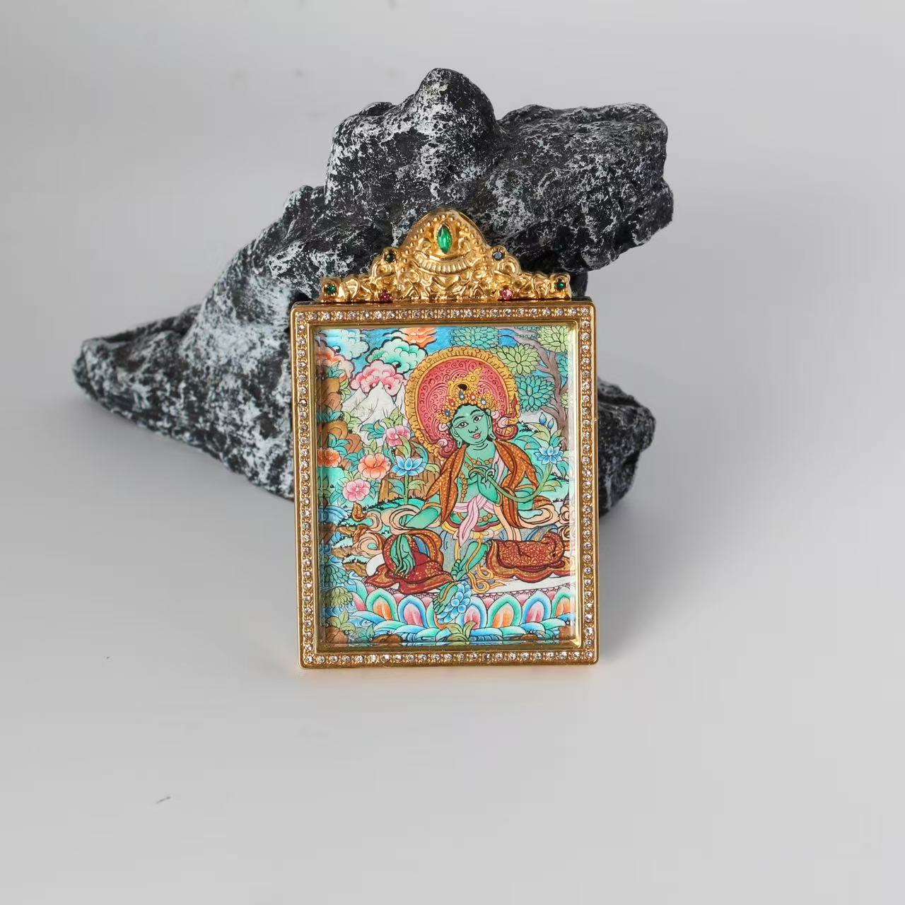 Close-up detail of the Nepal Premium Green Tara Thangka painting showing intricate natural mineral pigment work, showcasing the masterful artistry of Nepali lineage painters.
