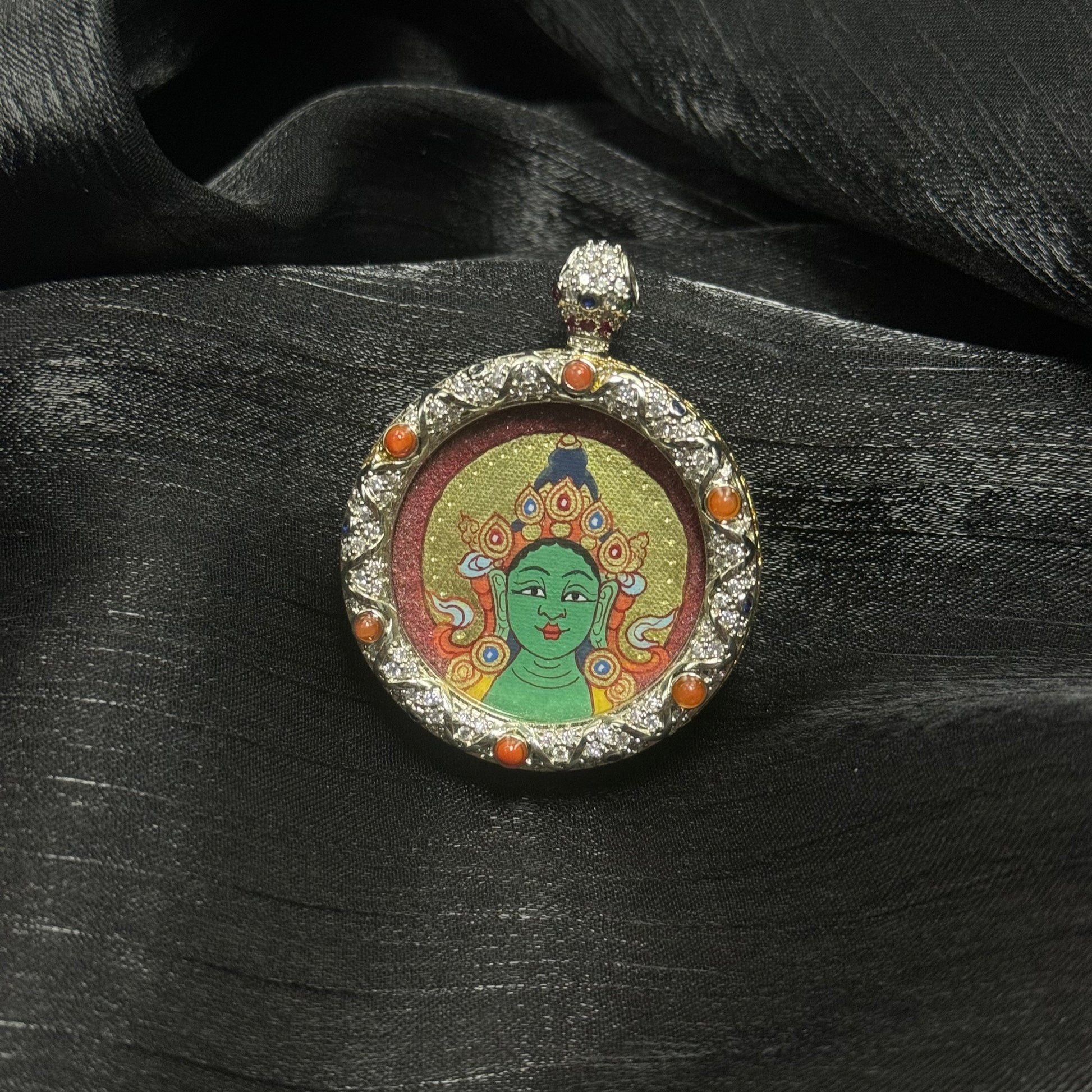  Close-up detail of the Rekong Red-Gold Green Tara Buddha Head Thangka painting showing mineral pigments and gold leaf, showcasing the masterful artistry of Rekong lineage painters.
