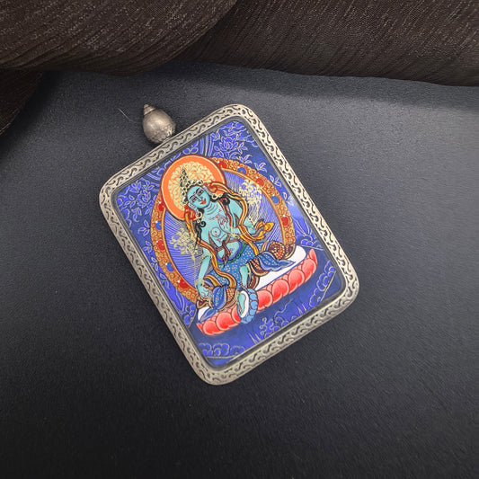  A 3.5x4.5cm hand-painted Rekong Blue Thangka Green Tara (绿度母) Thangka pendant with 925 silver featuring the goddess of compassion, representing protection and liberation in Buddhist tradition.
