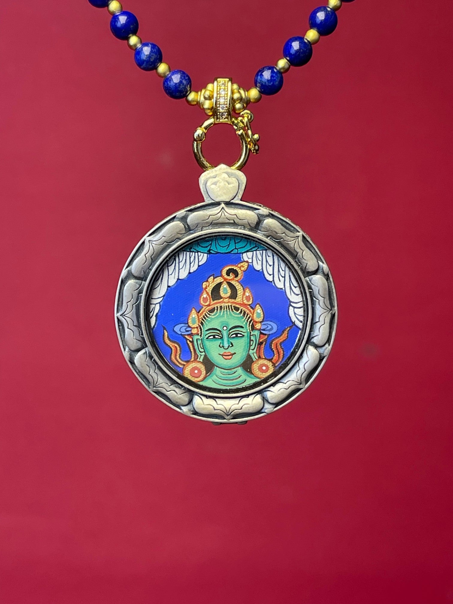 Close-up detail of the Rekong Green Tara Buddha Head Thangka showing natural mineral pigments, showcasing Rekong series artistry.
