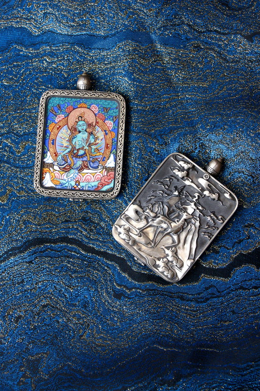 Close-up of the S925 sterling silver case with Dunhuang Nine-Colored Deer engraving, protecting the Green Tara Thangka.