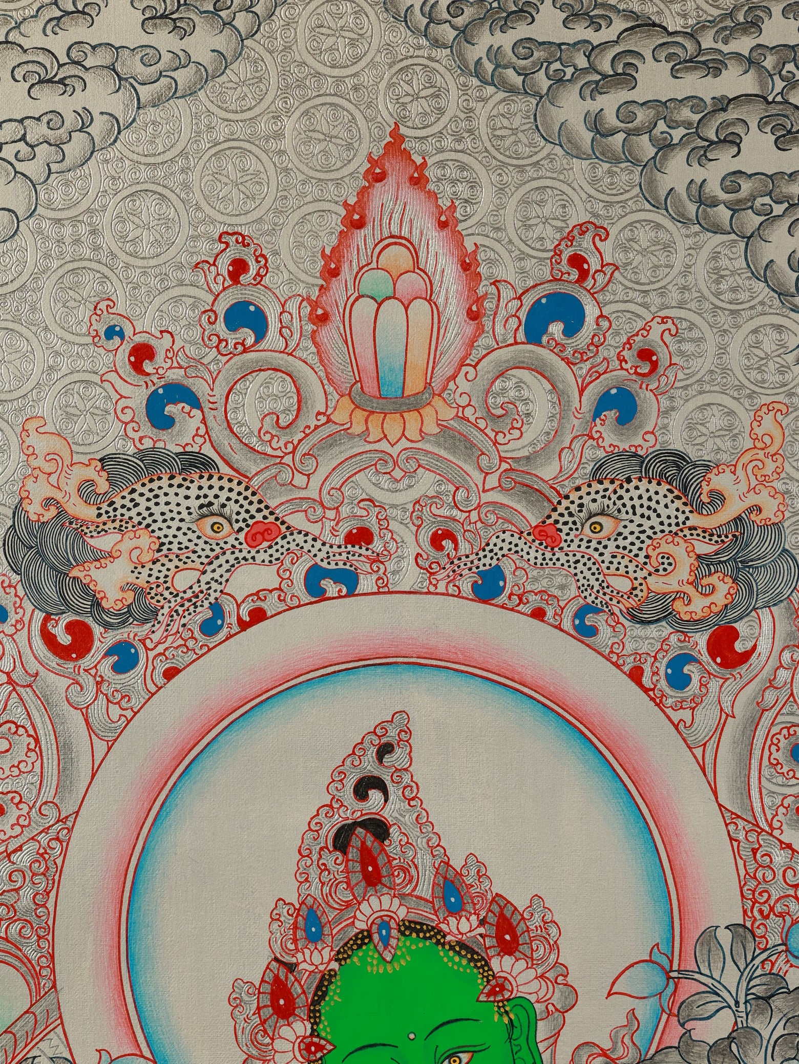 Green Tara as a protection deity in this Tibetan Buddhist Thangka.
