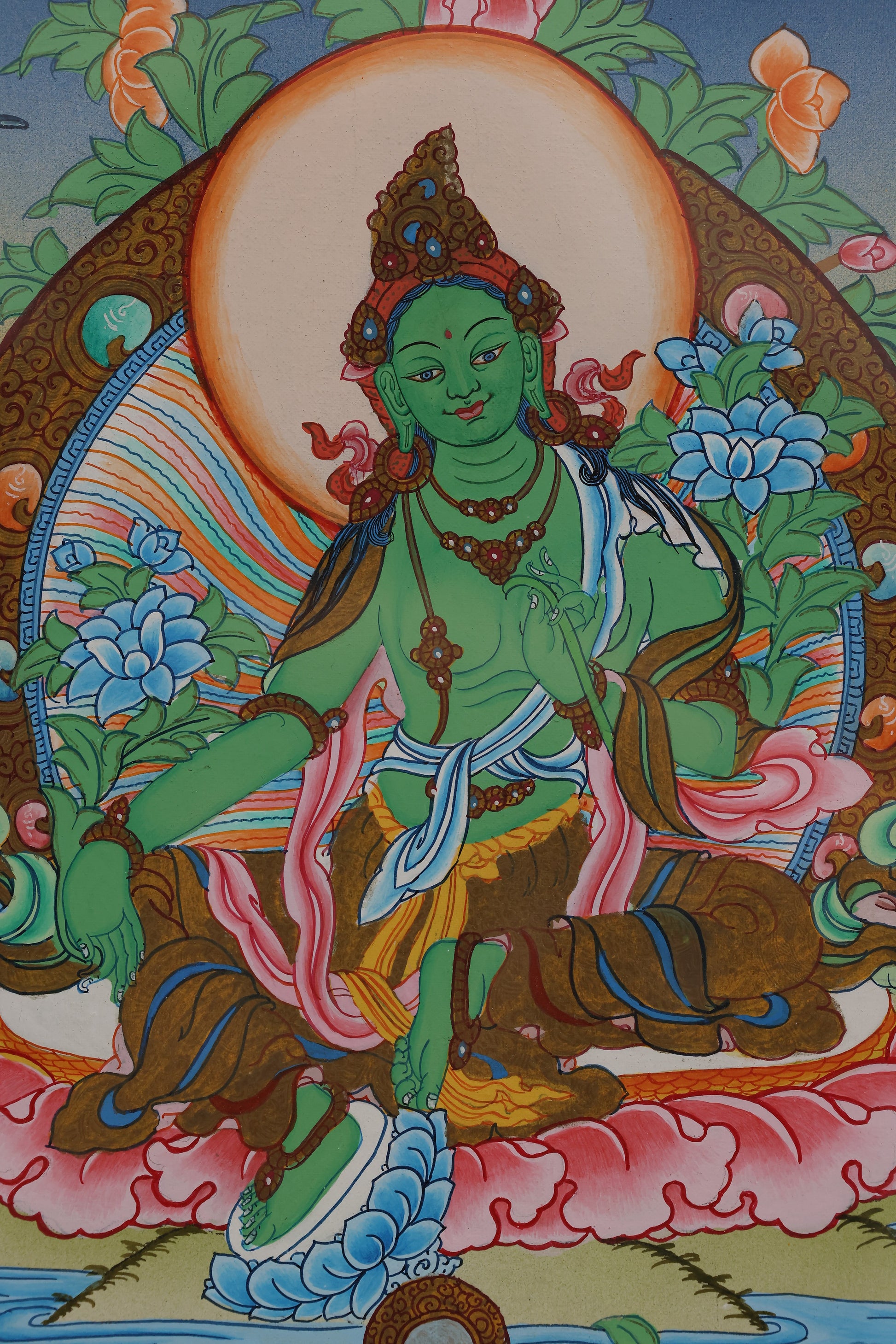 Alt text: Spiritual Green Tara Thangka, crafted with vibrant colors and Tibetan artistic techniques.