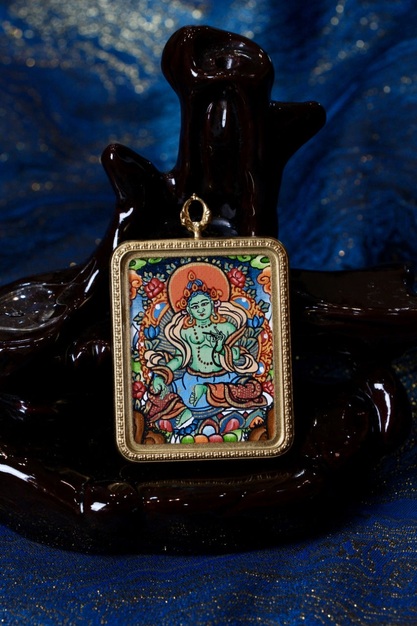 A serene Green Tara Thangka pendant, symbolizing peace, compassion, and blessings from the Tibetan Buddhist tradition.