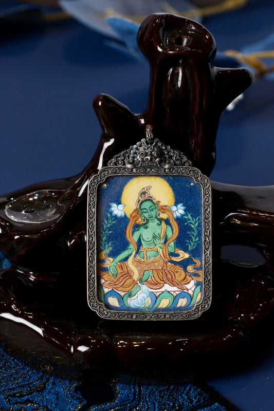 Green Tara Bodhisattva thangka pendant symbolizing compassion, courage, and enlightened action in Tibetan Buddhism.