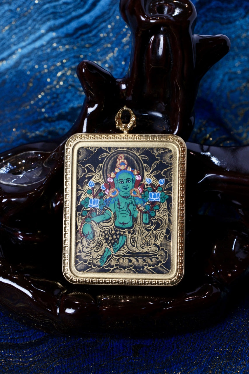 Syamatara thangka pendant representing Green Tara, the compassionate deity who offers protection and guidance in Tibetan Buddhism.