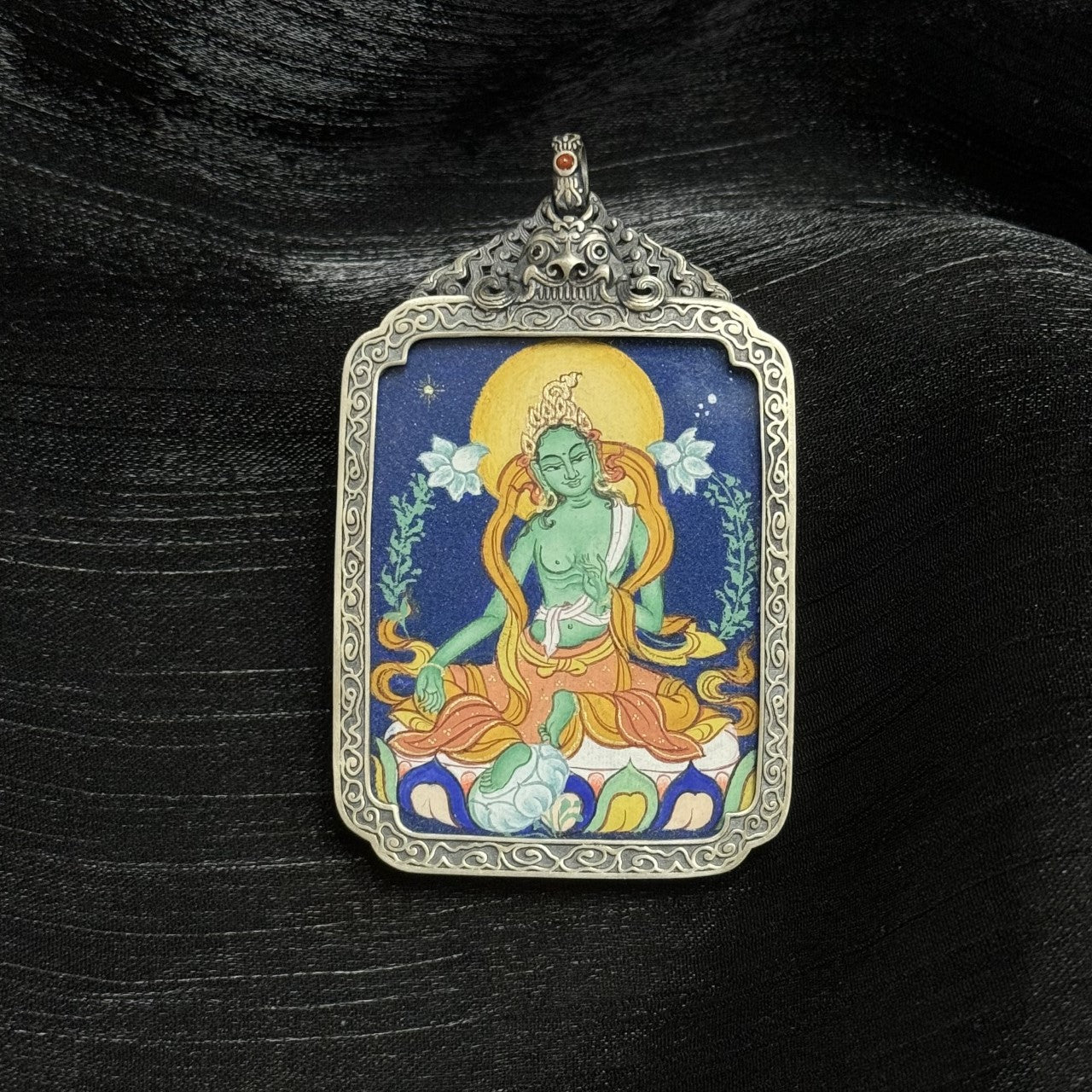  Close-up detail of the Green Tara Tibet Coarse Thangka painting showing intricate natural mineral pigment work, showcasing the artistry of Tibetan lineage painters.
