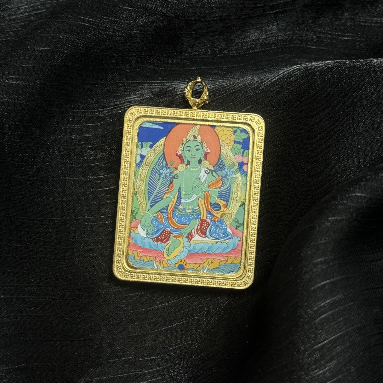  Close-up detail of the Tibet Elegant Green Tara Thangka painting showing intricate natural mineral pigment work, showcasing the masterful artistry of Tibetan lineage painters.
