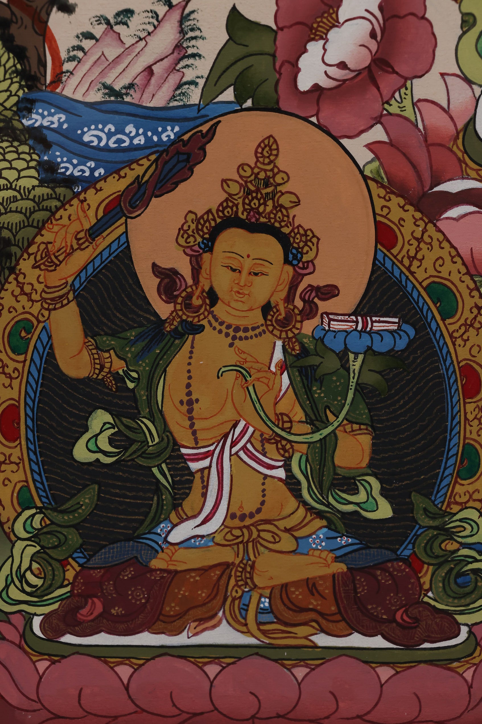 Alt Text: Hand-painted Tibetan Thangka of Guan Yin with a Thousand Eyes and Hands, representing vigilance and care.