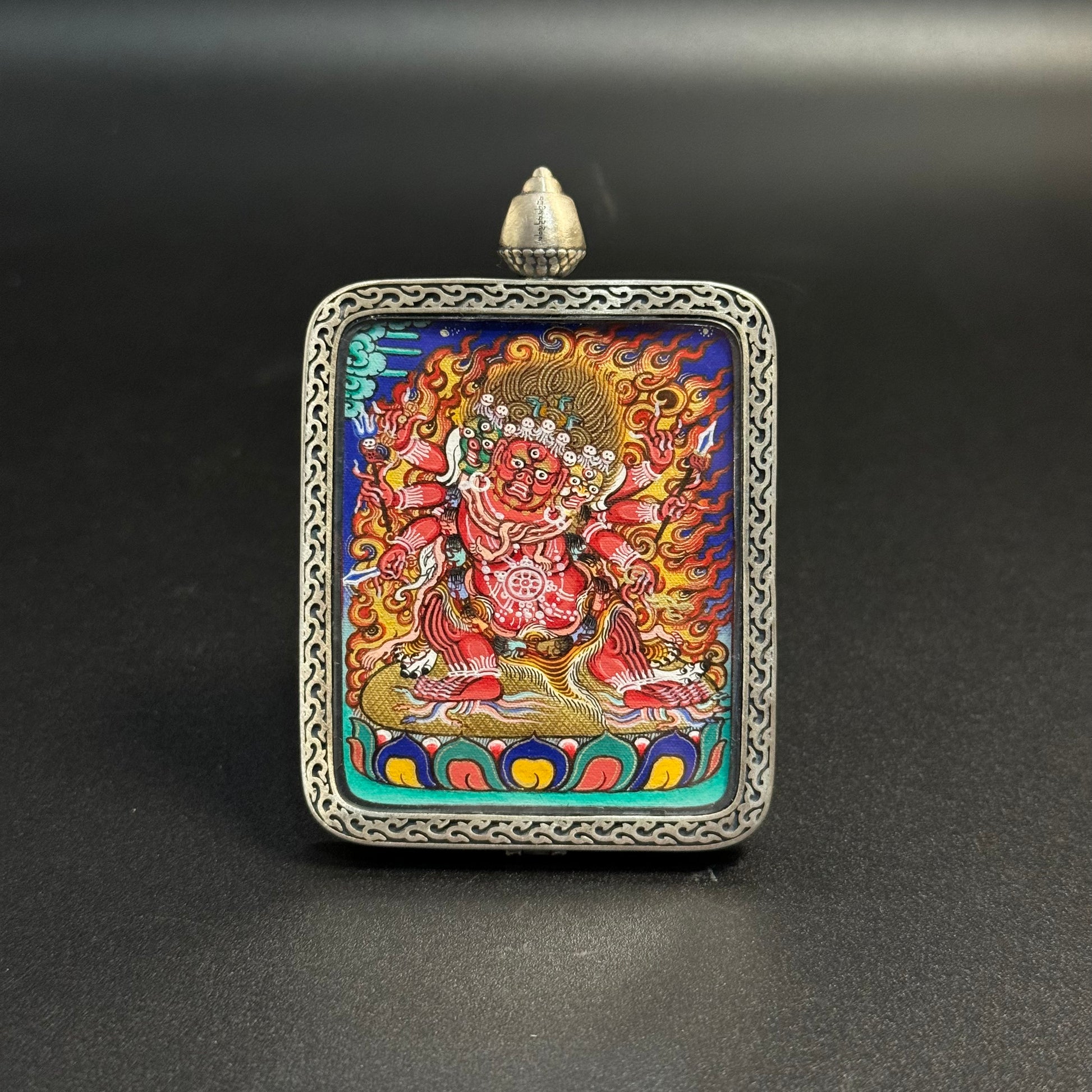  Detailed view of the presentation and casing for the Hayagriva Cuiying Thangka pendant.
