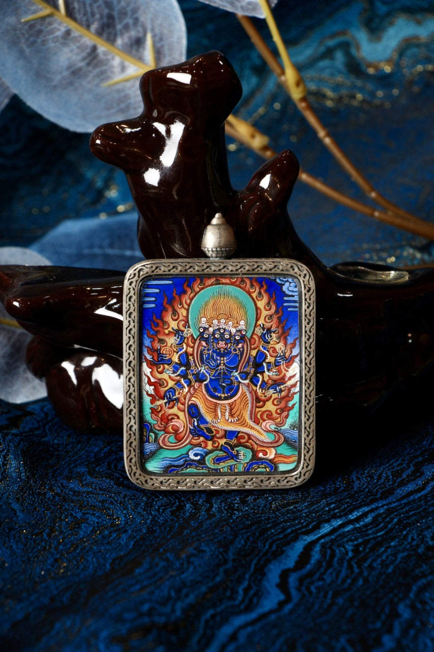 Tibetan thangka amulet featuring Heruka, revered in Tibetan Buddhism as a wrathful protector who removes obstacles and negativity.
