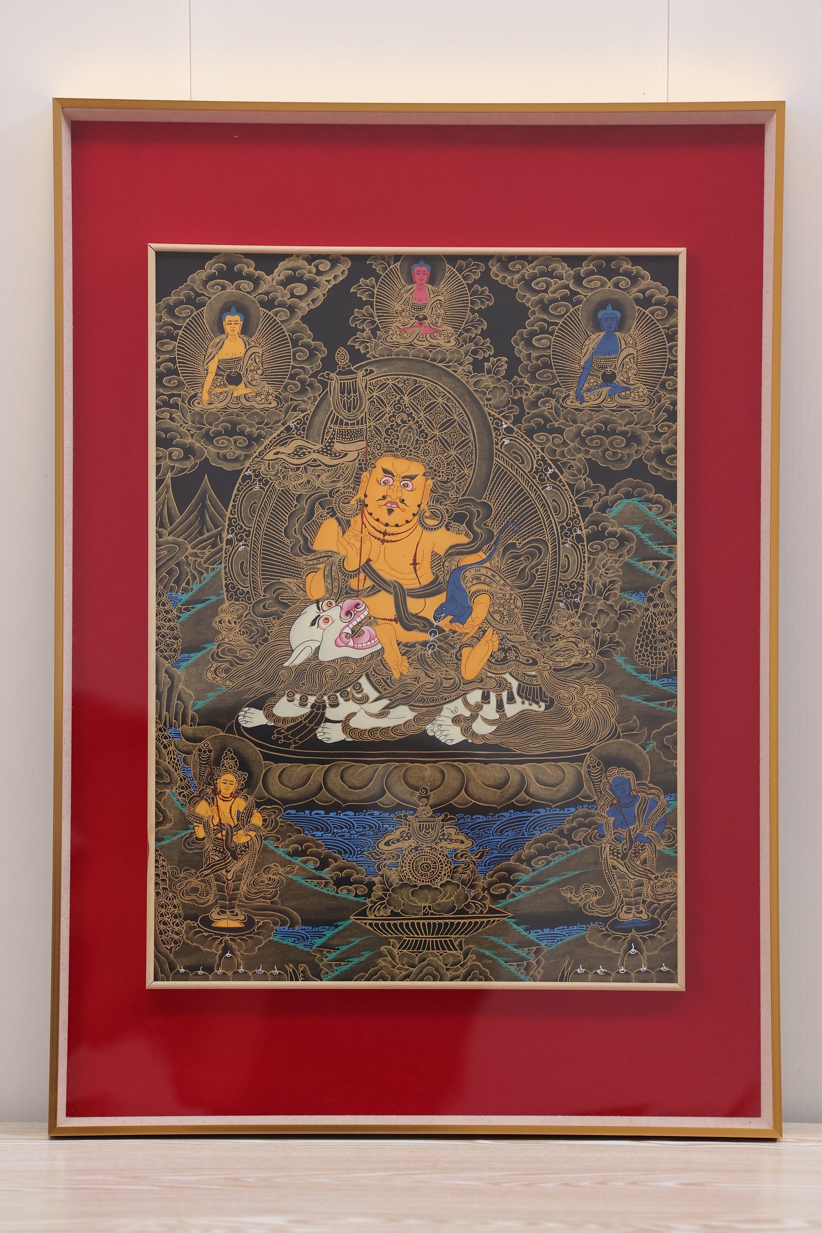 Traditional thangka art of the Golden Wealth Deity, a painting of the Tibetan Buddhist wealth-protecting dharmapala.