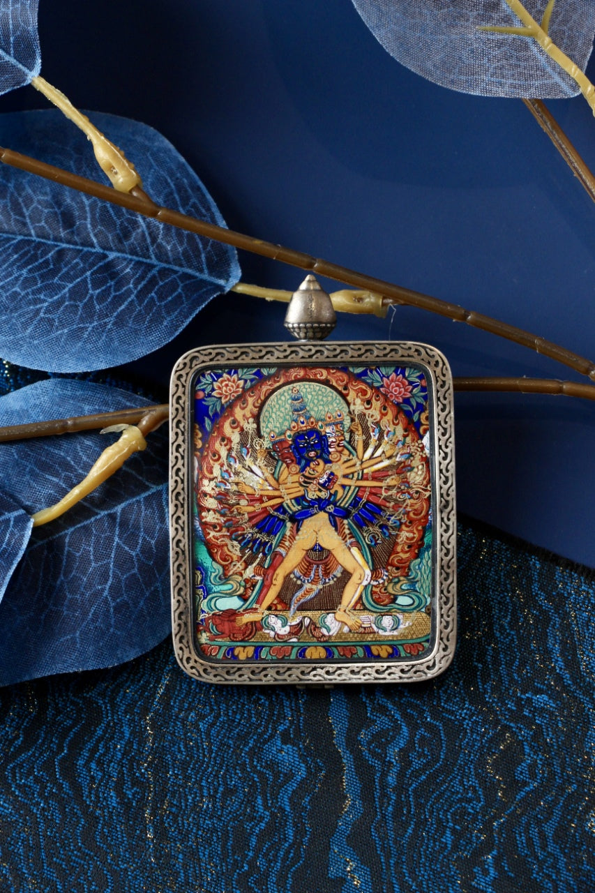Kalachakra Vajra thangka pendant depicting the Tibetan Buddhist deity of time and cosmic order, symbolizing enlightenment and tantric wisdom.