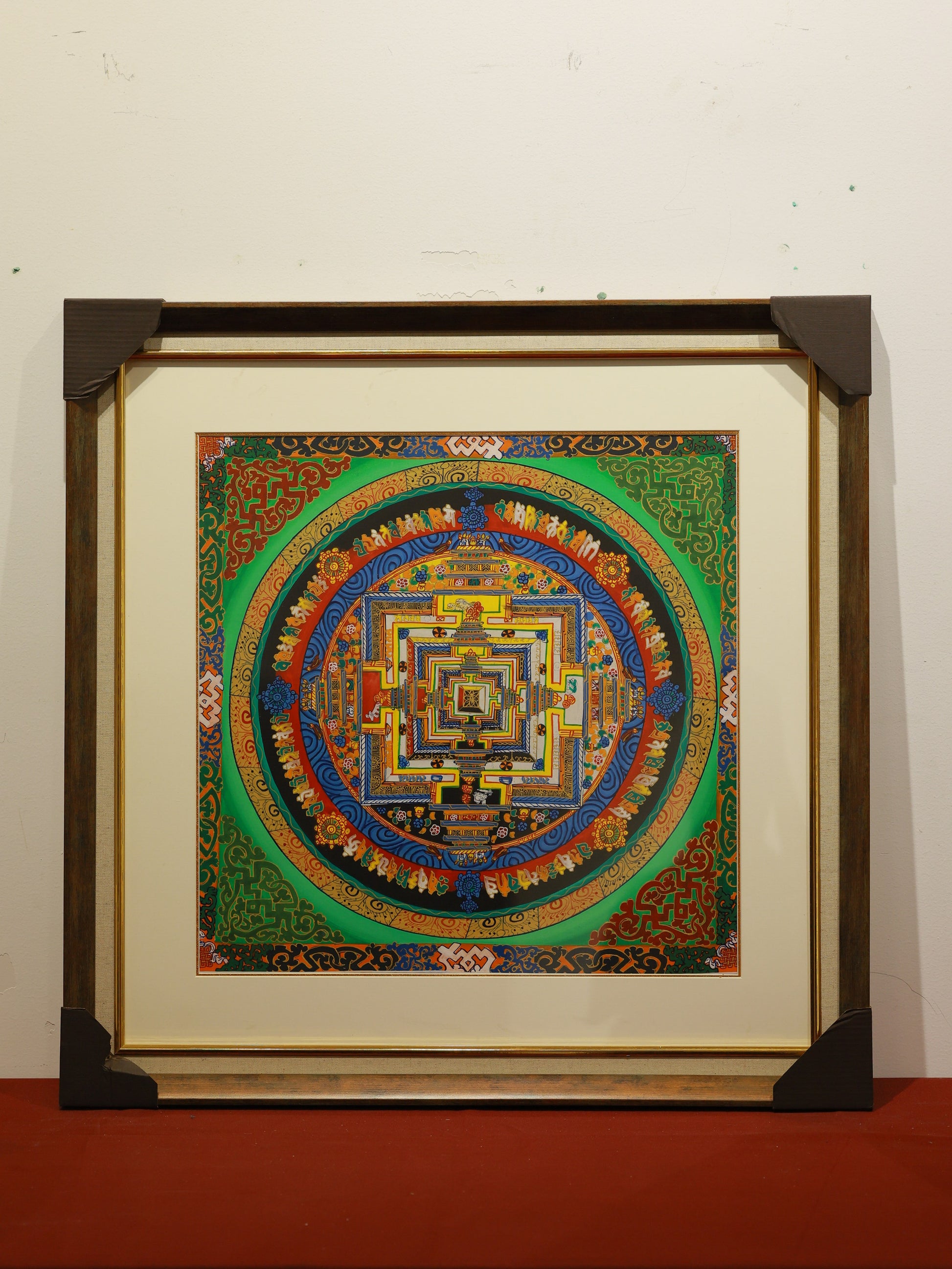 Hand-painted Tibetan Buddhist mandala thangka showing a symbolic palace of enlightenment, often used in Vajrayana rituals to remove obstacles and stabilize the mind.