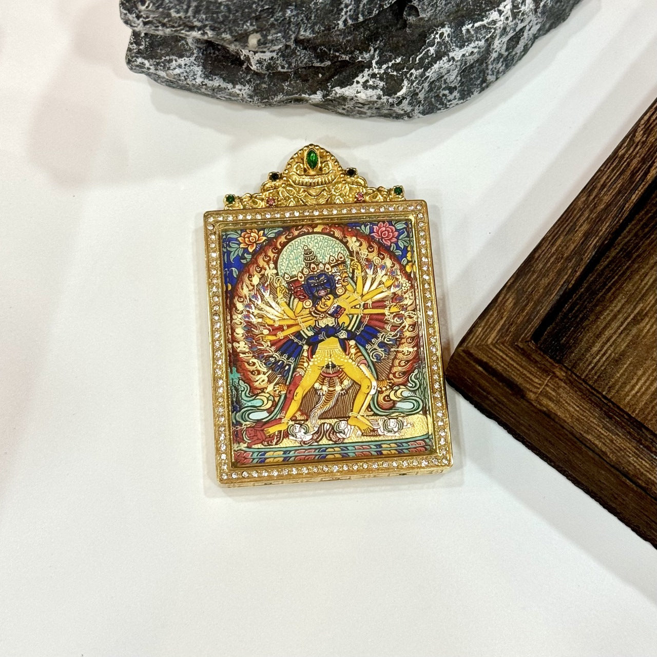 Detailed view of the titanium steel casing for the Kalachakra Thangka pendant, symbolizing protection and elegance in Tibetan Buddhist tradition.

