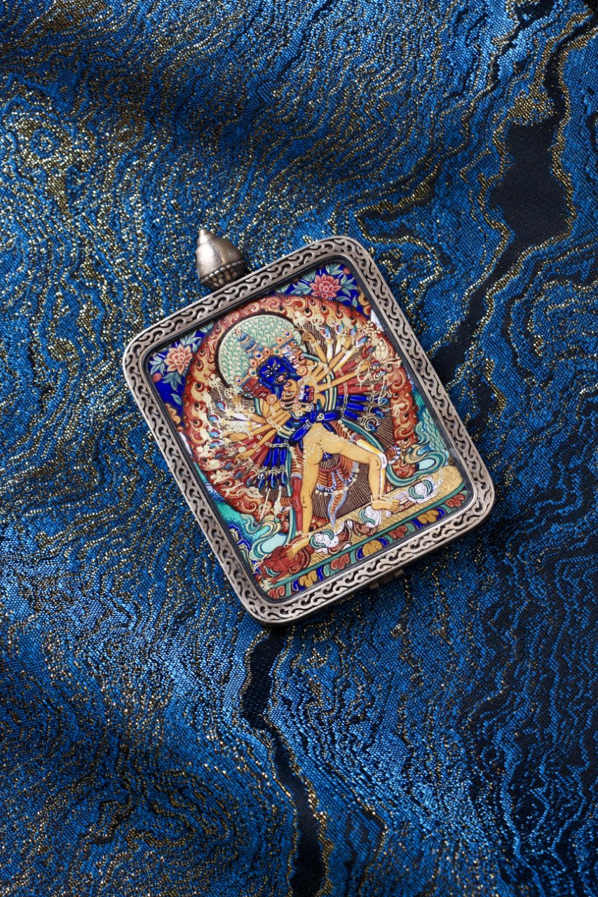 Tibetan thangka jewelry featuring Kalachakra Vajra, inspired by traditional Tibetan Buddhist sacred art.