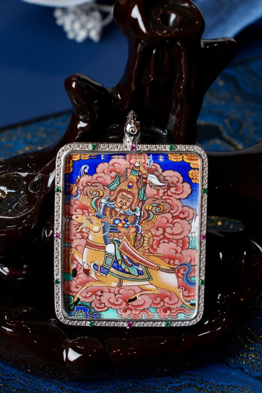 Tibetan Buddhist art thangka pendant portraying King Gesar as a warrior king, associated with protection, bravery, and sacred power.