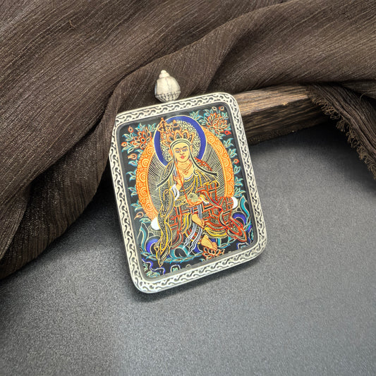  A 4x5cm hand-painted Rekong Black Gold Ksitigarbha (黑金藏王菩萨) Thangka pendant featuring the Great Vow Bodhisattva, representing liberation and compassion in Buddhist tradition.

