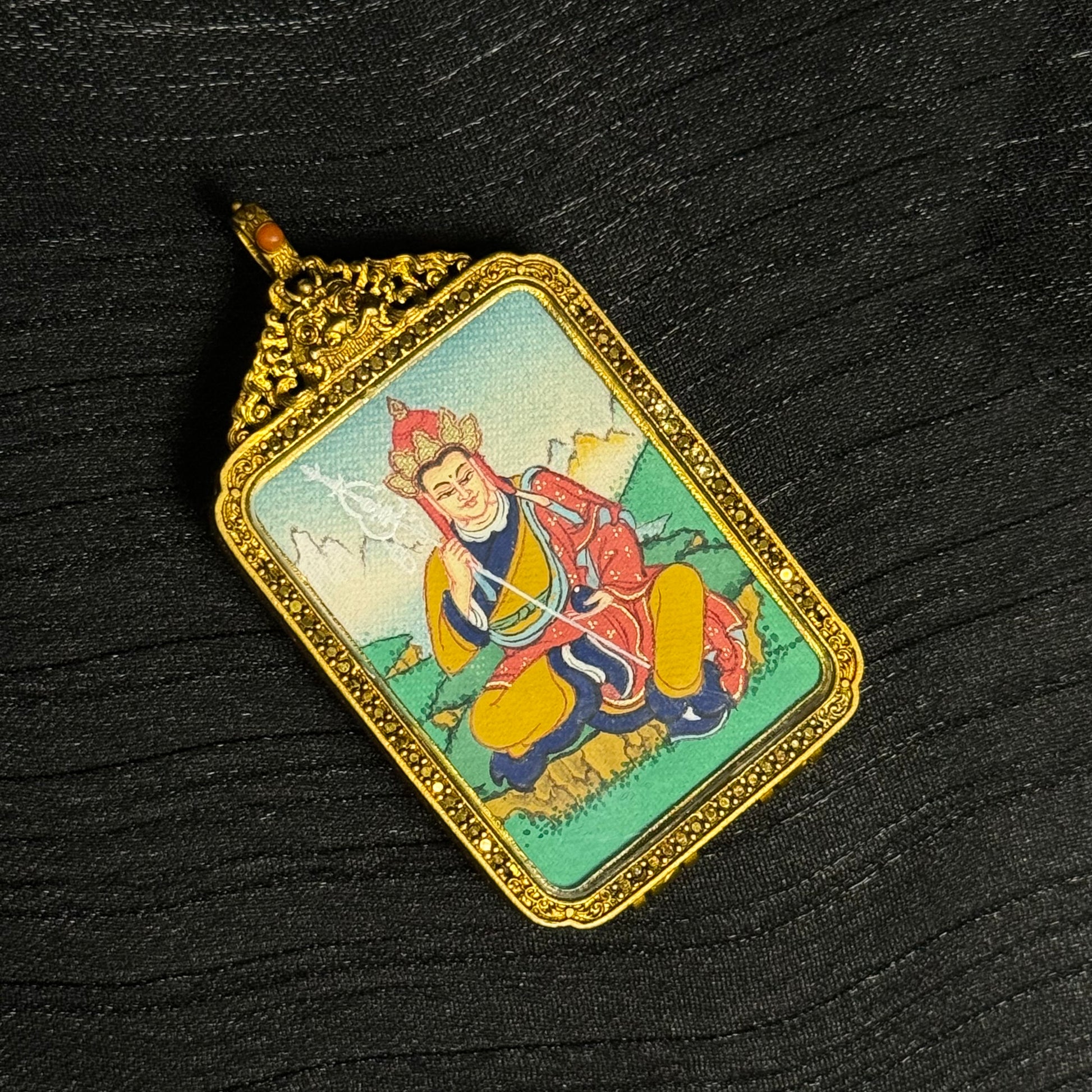 Close-up detail of the Tibet Ksitigarbha Thangka painting showing natural mineral pigments, showcasing the masterful artistry of Tibet lineage painters.
