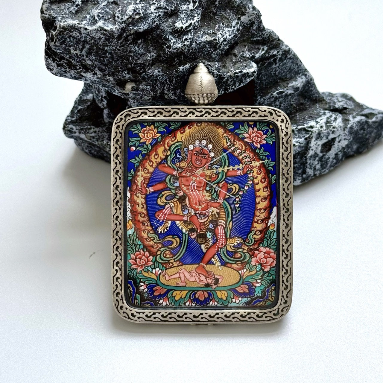 Detailed view of the Dunhuang Nine-Colour Deer silver casing for the Kurukulla Thangka pendant, symbolizing protection and elegance in Tibetan Buddhist tradition.
