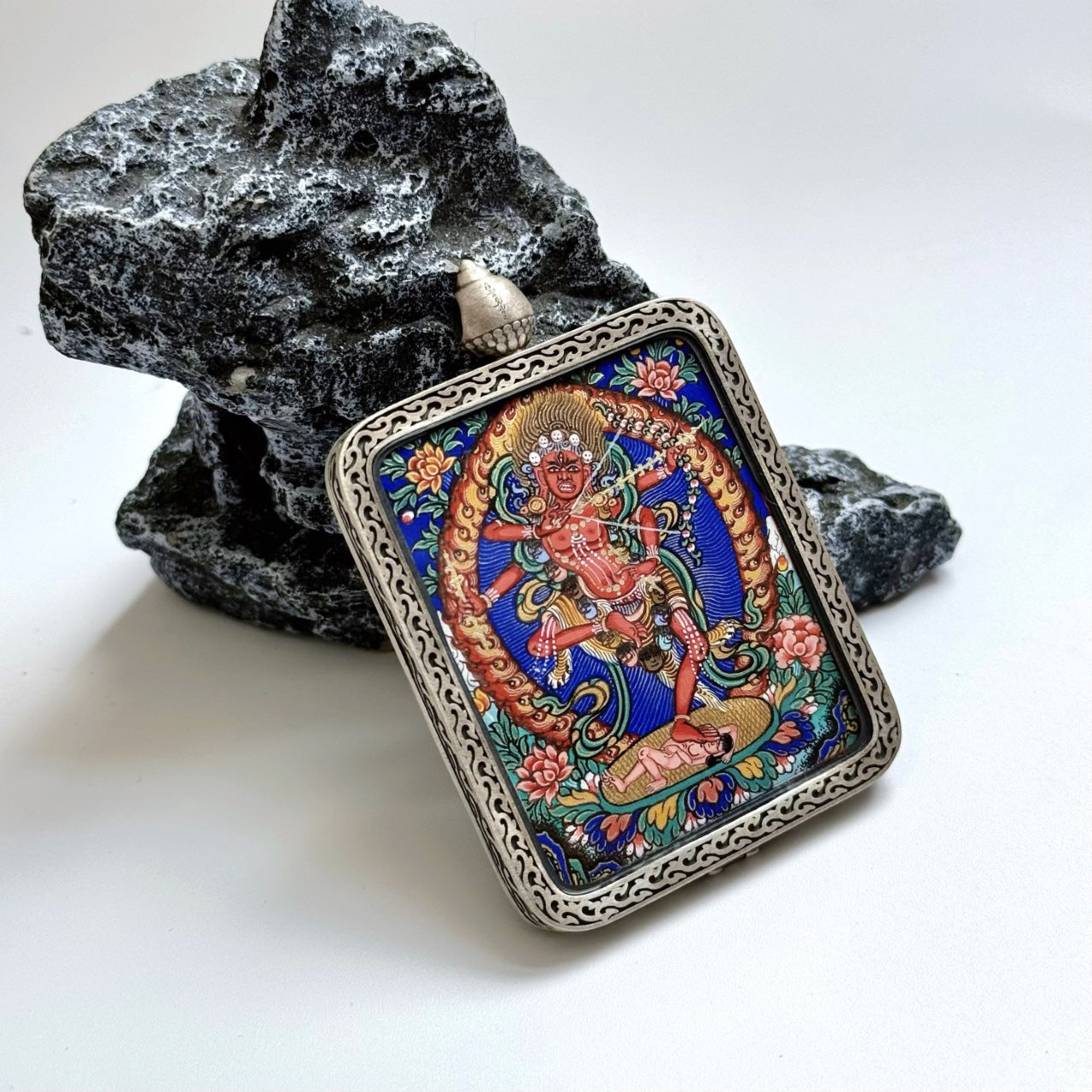 Close-up detail of the Kurukulla Rebgong Thangka painting showing intricate natural mineral pigment work, showcasing the artistry of Rebgong lineage painters.
