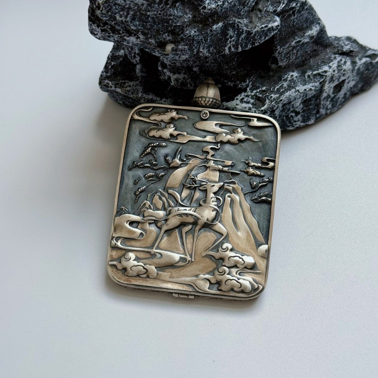 The Rebgong Kurukulla Thangka pendant displayed as a sacred amulet for love and worldly blessings, embodying Tibetan Buddhist tradition.
