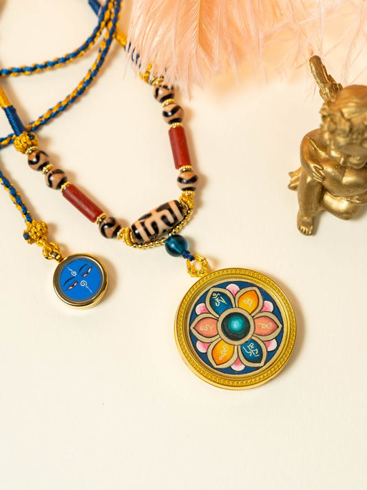  Close-up detail of the Rekong Lotus Six-Syllable Mantra Thangka showing gold-powder Om Mani Padme Hum on mineral pigment coloured lotus, showcasing very great merit.

