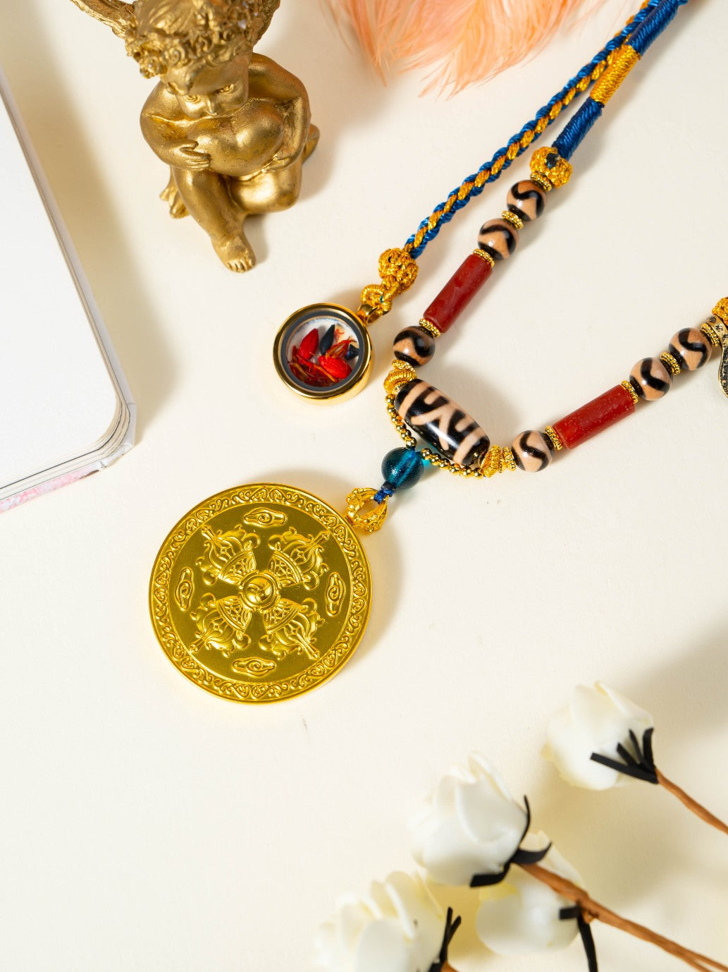  The Rekong Lotus Six-Syllable Mantra Thangka set with Dharma Eye and Dzi necklace displayed as a sacred amulet for eliminate suffering and longevity, embodying Buddhist tradition.
