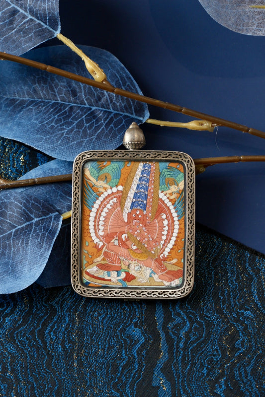 Maha Heruka wrathful deity thangka pendant representing fierce compassion, tantric wisdom, and the removal of obstacles in Tibetan Buddhism.