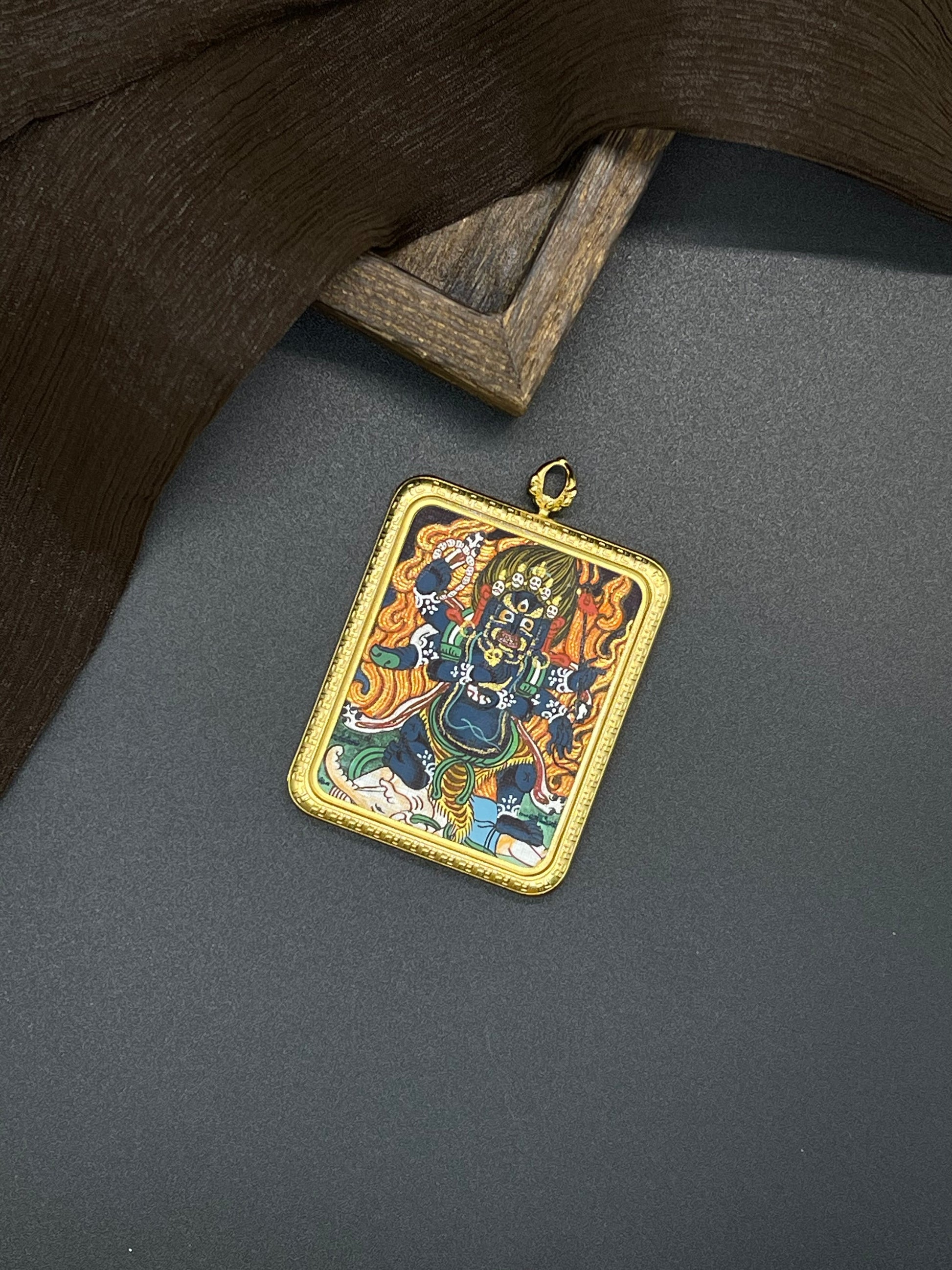 Hand-painted Nepal Mahakala (大黑天) Thangka pendant 4x5cm with titanium casing featuring the protector deity, representing warding off evil and the increase of merit and wisdom in Buddhist tradition.
